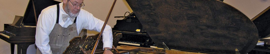 Tim Farley repairing a piano